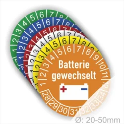 Bunte Batterie-Wechselaufkleber in verschiedenen Farben mit der Aufschrift "Batterie gewechselt" und Zahlen von 1 bis 12 und Jahreszahlen 28 bis 34 zur Kennzeichnung des Batteriewechsels, Durchmesser 20-50mm.
