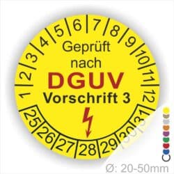 Prüfplakette rund mit Text geprüft nach Dguv Vorschrift 3 danach Elektropfeil in Rot. Plaketten Farbe- Gelb und Text in Schwarz. Monatszahlen oben und Jahreszahlen unten beginnend mit Startjahr- 25