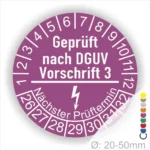 Alt-Text: Prüfplakette nach DGUV Vorschrift 3, rund, lila, mit Prüfnummern von 1 bis 12 und nächstem Prüftermin, für Geräte mit einem Durchmesser von 20-50 mm.