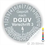 Alt-Text: Prüfplakette nach DGUV Vorschrift 3, mit Angaben zum nächsten Prüftermin und Durchmesser von 20-50 mm, auf grauem Hintergrund mit weißen Zahlen.