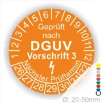 Prüfziffern für DGUV Vorschrift 3 auf einem orangefarbenen Prüfaufkleber, der den nächsten Prüftermin anzeigt. Geeignet für Durchmesser von 20-50 mm.