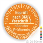 Sicherheitsprüfung Aufkleber nach DGUV Vorschrift 3, orange Rundetikett mit Prüfdatum und nächstem Prüftermin, Durchmesser 20-50 mm.