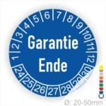 Prüfetiketten, Prüfaukleber rund, Farbe- Blau, Text auf Englisch "Garantie Ende" in Weiß. Startjahr- 24, Monatszahlen Oben und Jahreszahlen Unten in Kreisform.