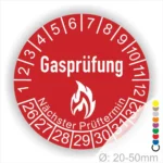 Rotes Gasprüfungslabel mit dem Text "Gasprüfung" und "Nächster Prüftermin" Kennzeichnung der nächsten Gasprüfung mit Feuer-Icon und Zahlen von 1 bis 12 Monatszahlen und 26-32 Jahreszahlen. Ideal für die Sicherheit von Gasinstallationen. Durchmesser 20-50 mm.