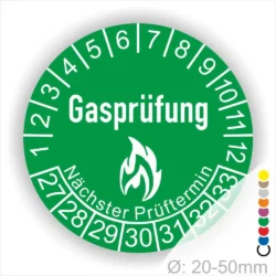 Grünes Prüfzeichen für Gasprüfungen mit der Beschriftung "Gasprüfung" und dem Hinweis "Nächster Prüftermin". Die Skala zeigt die Monate des Jahres und ist für Durchmesser von 20-50 mm geeignet.