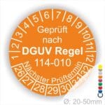 Prüfplakette, Prüfsiegel rund mit Text geprüft nach DGUV Regel 114-010 Nächster Prüftermin. Plaketten Farbe- Orange und Text in Weiss. Monatszahlen oben und Jahreszahlen unten beginnend mit Startjahr- 26