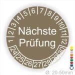 Prüfplaketten, Prüfetiketten rund, Farbe- Braun, Text "Nächste Prüfung" in Weiß. Startjahr- 24, Monatszahlen Oben und Jahreszahlen Unten in Kreisform.