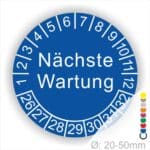 Prüfplaketten, Prüfetiketten rund, Farbe- Blau, Text "Nächste Wartung" in Weiß. Startjahr- 26, Monatszahlen Oben und Jahreszahlen Unten in Kreisform.