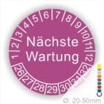 Prüfplaketten, Prüfetiketten rund, Farbe- Lila, Text "Nächste Wartung" in Weiß. Startjahr- 26, Monatszahlen Oben und Jahreszahlen Unten in Kreisform.