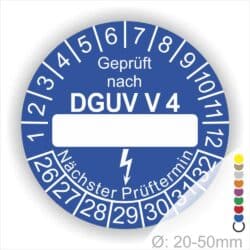 Prüfplakette rund mit Text geprüft nach DGUV Vorschrift 4 danach Beschriftungsfeld in Weiß und Text Nächster Prüftermin. Plaketten Farbe- Blau und Text in Weiß. Monatszahlen oben und Jahreszahlen unten beginnend mit Startjahr- 26.