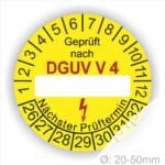 Prüfplakette rund mit Text geprüft nach DGUV Vorschrift 4 danach Beschriftungsfeld in Weiß und Text Nächster Prüftermin. Plaketten Farbe- Gelb und Text in Schwarz. Monatszahlen oben und Jahreszahlen unten beginnend mit Startjahr- 26.