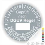 Prüfplakette rund mit Text geprüft nach DGUV Regel danach Beschriftungsfeld in Weiß und Text Nächster Prüftermin. Plaketten Farbe- Grau und Text in Weiß. Monatszahlen oben und Jahreszahlen unten beginnend mit Startjahr- 26. Durchmesser 20-50mm frei wählbar.