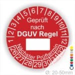 Prüfplakette rund mit Text geprüft nach DGUV Regel danach Beschriftungsfeld in Weiß und Text Nächster Prüftermin. Plaketten Farbe- Rot und Text in Weiß. Monatszahlen oben und Jahreszahlen unten beginnend mit Startjahr- 26. Durchmesser 20-50mm frei wählbar.