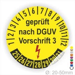 Prüfplakette rund mit Text geprüft nach Dguv Vorschrift 3 danach Elektropfeil in rot. Plaketten Farbe-gelb und Text in schwarz. Monastzahlen oben und Jahreszahlen unten beginnend mit Startjahr- 25