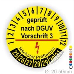 Prüfplakette rund mit Text geprüft nach Dguv Vorschrift 3 und Nächster Prüftermin mit zwischenstrich danach Elektropfeil in rot. Plaketten Farbe- gelb und Text in schwarz. Monastzahlen oben und Jahreszahlen unten beginnend mit Startjahr- 25