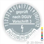 Prüfsiegel nach DGUV Vorschrift 3 für Geräte mit einem Durchmesser von 20-50 mm, inklusive nächstem Prüftermin und Farbcodes zur Kennzeichnung.