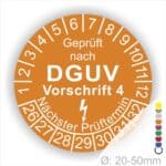 Prüfplakette rund mit Text geprüft nach Dguv Vorschrift 3 danach Elektropfeilund Text Nächster Prüftermin. Plaketten Farbe- Orange und Text in Weiß. Monatszahlen oben und Jahreszahlen unten beginnend mit Startjahr- 26