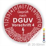 Prüfplakette rund mit Text geprüft nach Dguv Vorschrift 3 danach Elektropfeilund Text Nächster Prüftermin. Plaketten Farbe- Rot und Text in Weiß. Monatszahlen oben und Jahreszahlen unten beginnend mit Startjahr- 26