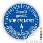 Prüfsiegel für elektrische Geräte gemäß VDE 0701/0702, blaues Design mit Angabe des nächsten Prüftermins und Durchmesser von 20-50 mm.