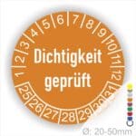 Prüfetiketten, Prüfaukleber rund, Farbe- Orange, Text auf Englisch "Dichtigkeit geprüft" in Weiß. Startjahr- 25, Monatszahlen Oben und Jahreszahlen Unten in Kreisform.