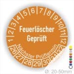 Prüfetiketten, Prüfaukleber rund, Farbe- Orange, Text auf Englisch "Feuerlöscher geprüft" in Weiß. Startjahr- 26, Monatszahlen Oben und Jahreszahlen Unten in Kreisform.