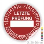 Prüfplaketten, rund, Farbe- Rot, Text "LETZTE PRÜFUNG" in Weiß. Als nächstes kommt ein Beschriftungfeld / Leerfeld in Farbe Weiß. Startjahr- 25, Monatszahlen Oben und Jahreszahlen Unten in Kreisform in Weiß.