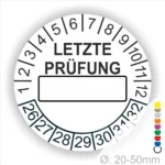 Weiss Prüfaufkleber mit der Aufschrift "LETZTE PRÜFUNG" und Platz für das Datum. Der Aufkleber zeigt Zahlen von 1 bis 12 und von 26 bis 32. Durchmesser von 20-50 mm, geeignet für regelmäßige Sicherheitsüberprüfungen.
