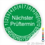 Prüfplakette mit Text Nächster Prüftermin Startjahr- 26, Monatszahlen Oben und Jahreszahlen Unten in Kreisform. Farbe Gruen