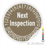 Prüfplaketten, Prüfetiketten rund, Farbe- Braun, Text auf Englisch "Next Inspection" in Weiß. Startjahr- 24, Monatszahlen Oben und Jahreszahlen Unten in Kreisform.