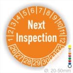 Prüfplaketten, Prüfetiketten rund, Farbe- Orange, Text auf Englisch "Next Inspection" in Weiß. Startjahr- 26, Monatszahlen Oben und Jahreszahlen Unten in Kreisform.