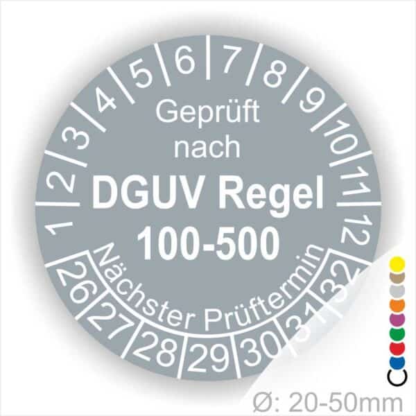 Prüfplakette rund mit Text geprüft nach DGUV Regel 100-500 Nächster Prüftermin. Plaketten Farbe- Grau und Text in Weiß. Monatszahlen oben und Jahreszahlen unten beginnend mit Startjahr- 26
