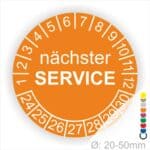 Prüfplaketten, Prüfetiketten rund, Farbe- Orange, Text "nächster SERVICE" in Weiß. Startjahr- 24, Monatszahlen Oben und Jahreszahlen Unten in Kreisform.