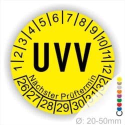 Prüfplaketten rund, Farbe- Gelb, Text "UVV" in Schwarz. Startjahr- 26, Monatszahlen Oben und Jahreszahlen Unten in Kreisform über den Jahreszahlen Text "Nächster Prüftermin"