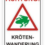 Achtungsschild für Krötenwanderung mit einem grünen Froschsymbol, das Autofahrer auf die saisonale Wanderung von Kröten hinweist.