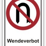 Verkehrszeichen mit dem Hinweis auf ein Wendeverbot, dargestellt durch ein rotes Durchkreuzungsymbol über einem stilisierten 'n' und dem Wort "Wendeverbot" darunter.