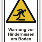 Warnschild mit der Aufschrift "Warnung vor Hindernissen am Boden" und einer grafischen Darstellung einer Person, die über ein Hindernis stolpert.