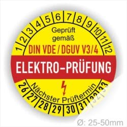 Prüfsiegel, Prüfplaketten rund, Farbe- Gelb in der Mitte ein Streifen in Rot, Text oberer Teil "Geprüft gemäß DIN-VDE/DGUV V3/4" in Schwarz. Mittig Streifen in Rot mit dem Text " ELEKTRO-PRÜFUNG", danach Elektropfeil in Rot Startjahr- 26, Monatszahlen Oben und Jahreszahlen Unten in Kreisform. Über den Jahreszahlen Text "Nächster Prüftermin"