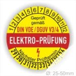 Prüfetiketten, Prüfplaketten rund, Farbe- Gelb in der Mitte ein Streifen in Rot, Text oberer Teil "Geprüft gemäß DIN-VDE/DGUV V3/4" in Schwarz. Mittig Streifen in Rot mit dem Text " ELEKTRO-PRÜFUNG", danach Elektropfeil in Rot Startjahr- 29, Monatszahlen Oben und Jahreszahlen Unten in Kreisform. Über den Jahreszahlen Text "Nächster Prüftermin"