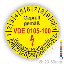 DIN VDE 0105 Prüfplaketten Prüfplaketten rund, Text "geprüft gemäß VDE 0105-100" Farbe- Gelb Startjahr- 26 mit Elektro Pfeil, Monatszahlen Oben und Jahreszahlen Unten fürWiederholungsprüfungen für Elektrische Gebäudeinstallationen und ihre Betriebsmittel