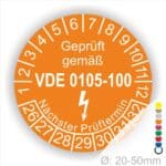 Prüfplaketten rund, Text "geprüft gemäß VDE 0105-100" Farbe- Orange Startjahr- 26 mit Elektro Pfeil, Monatszahlen Oben und Jahreszahlen Unten