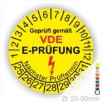 VDE E-Pruefung Pruefplaketten rund Text "geprüft gemäß VDE E-Prüfung" Farbe- Gelb Startjahr- 25 mit Elektro Pfeil, Monatszahlen Oben und Jahreszahlen Unten