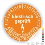 Prüfplaketten rund Farbe- Orange, Text "Elektrisch geprüft" in Weiß Startjahr- 26 mit Elektro Pfeil, Monatszahlen Oben und Jahreszahlen Unten in Kreisform