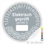 Pruefplakette mit Text Elektrisch geprüft gemäß Paragrapf als Zeichen und Beschriftungfeld zum eintragen des Paragraphs Farbe- Grau Startjahr- 26 mit Monatszahlen Oben und Jahreszahlen Unten Form ist Rund
