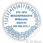 Prüfplaketten, Prüfetiketten rund, Farbe- Weiß, Text "STK/MTK MEDIZINPRODUKTE MPBetreibV, DGUV-V3, DIN VDE 0751-1 Nächster Prüftermin" in Blau. Startjahr- 28, Monatszahlen Oben und Jahreszahlen Unten in Kreisform. über den Jahreszahlen Text.