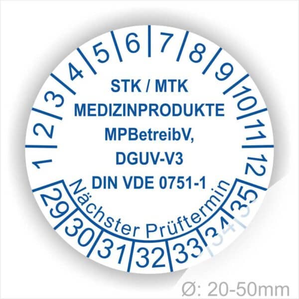 Prüfplaketten, Prüfetiketten rund, Farbe- Weiß, Text "STK/MTK MEDIZINPRODUKTE MPBetreibV, DGUV-V3, DIN VDE 0751-1 Nächster Prüftermin" in Blau. Startjahr- 29, Monatszahlen Oben und Jahreszahlen Unten in Kreisform. über den Jahreszahlen Text.