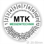 Prüfplaketten, Prüfetiketten rund, Farbe- Weiß, Text "Medizintechnische Kontrolle, MTK MEDIZINTECHNIK Nächster Prüftermin" in Schwarz. Startjahr- 25, Monatszahlen Oben und Jahreszahlen Unten in Kreisform. über den Jahreszahlen Text.