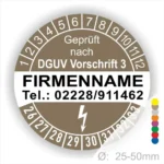 Alt-Text: Rundes Prüfzeichen gemäß DGUV Vorschrift 3, mit Platz für Firmennamen und Telefonnummer, Durchmesser 25-50mm, farbige Markierungen zur Kennzeichnung.