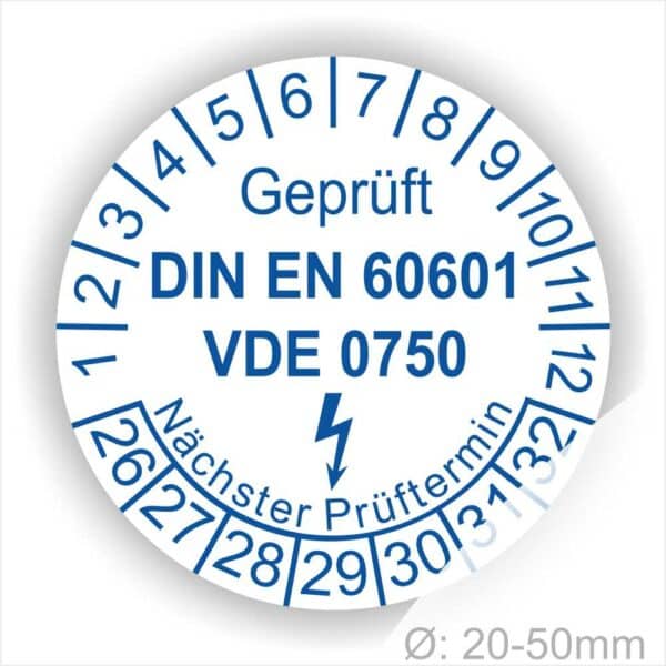 Prüfetiketten rund, Farbe- Weiß, Text "Geprüft DIN EN 60601 und VDE 0750" in Blau danach ein Elektro- Pfeil in Blau, Startjahr- 26, Monatszahlen Oben und Jahreszahlen Unten in Kreisform. Über den Jahreszahlen Text "Nächster Prüftermin"