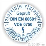 Prüfaufkleber, Prüfplaketten rund, Farbe- Weiß, Text "Geprüft DIN EN 60601 und VDE 0750" in Blau danach ein Elektro- Pfeil in Blau, Startjahr- 29, Monatszahlen Oben und Jahreszahlen Unten in Kreisform. Über den Jahreszahlen Text "Nächster Prüftermin"