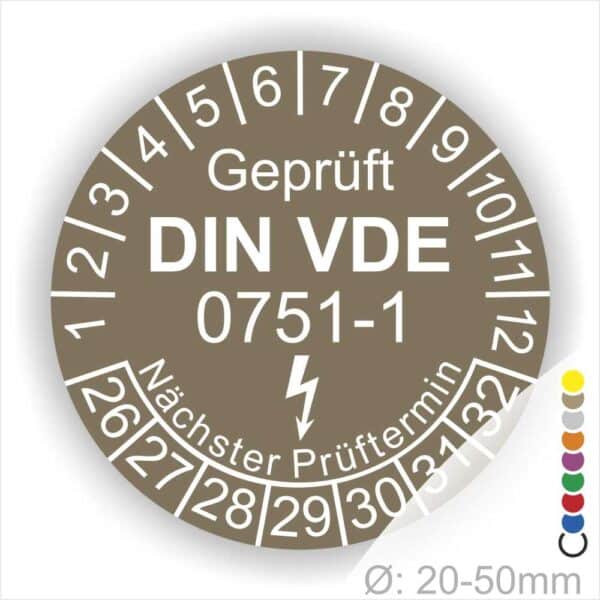 Prüfplaketten rund, Farbe- Braun, Text "Geprüft gemäß DIN VDE 0751-1" in Weiß danach ein Elektro- Pfeil in Weiß, Startjahr- 26, Monatszahlen Oben und Jahreszahlen Unten in Kreisform. Über den Jahreszahlen Text "Nächster Prüftermin"